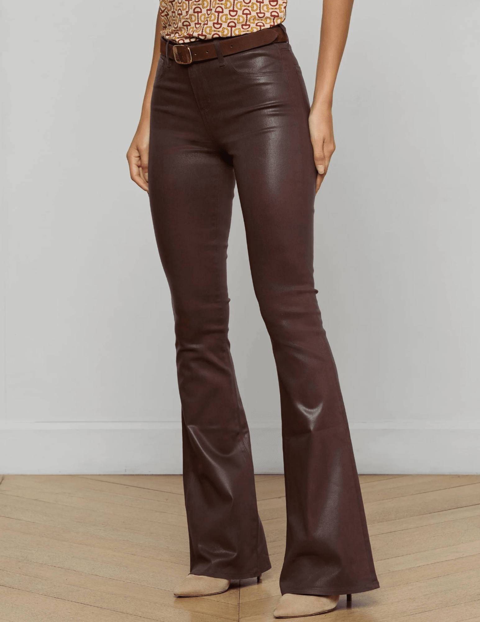 Side View of L’AGENCE Marty Ultra High Rise Coated Chocolate Flare Jeans on Model