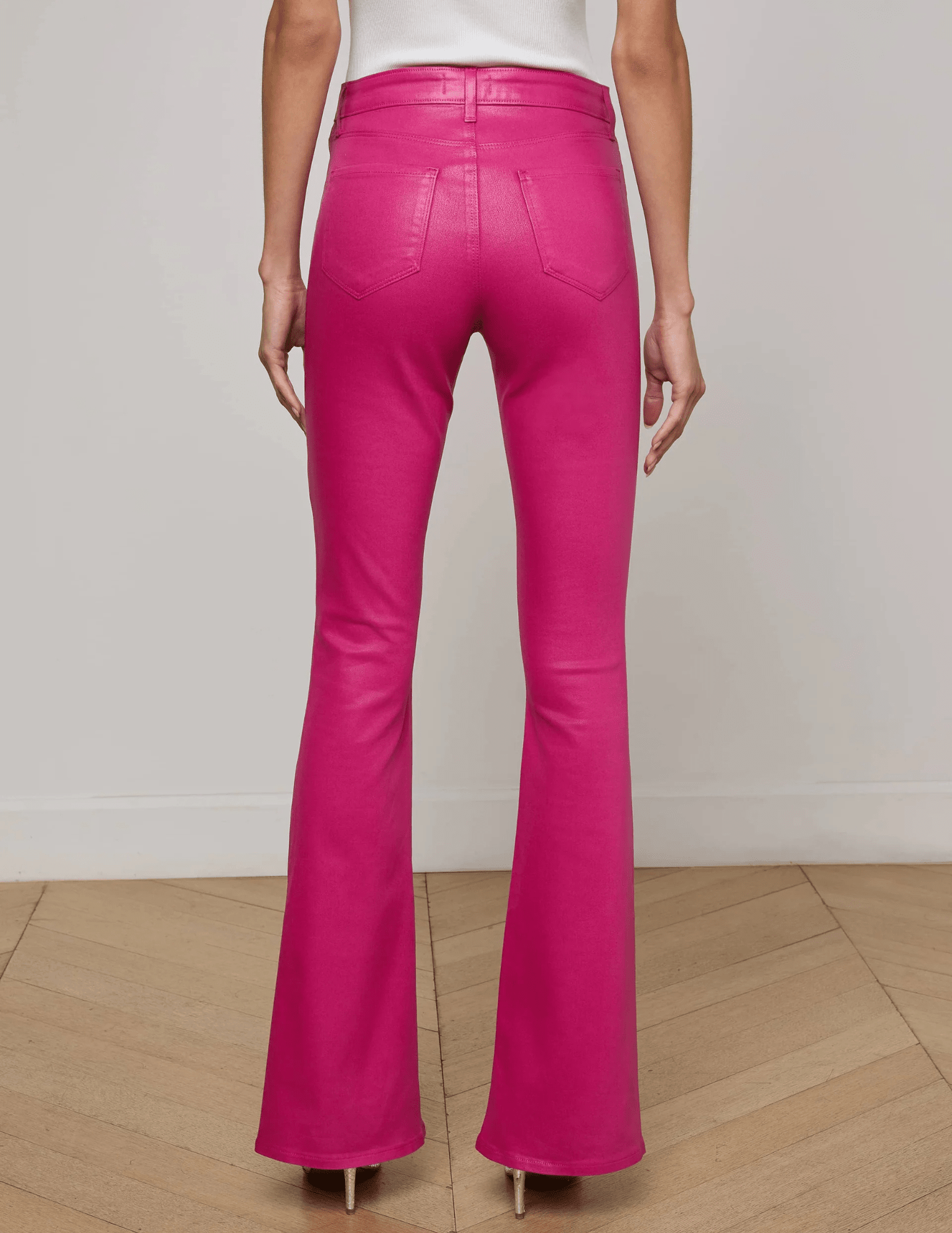 Back view of L’AGENCE Marty Pink Coated Denim Jean with flared leg