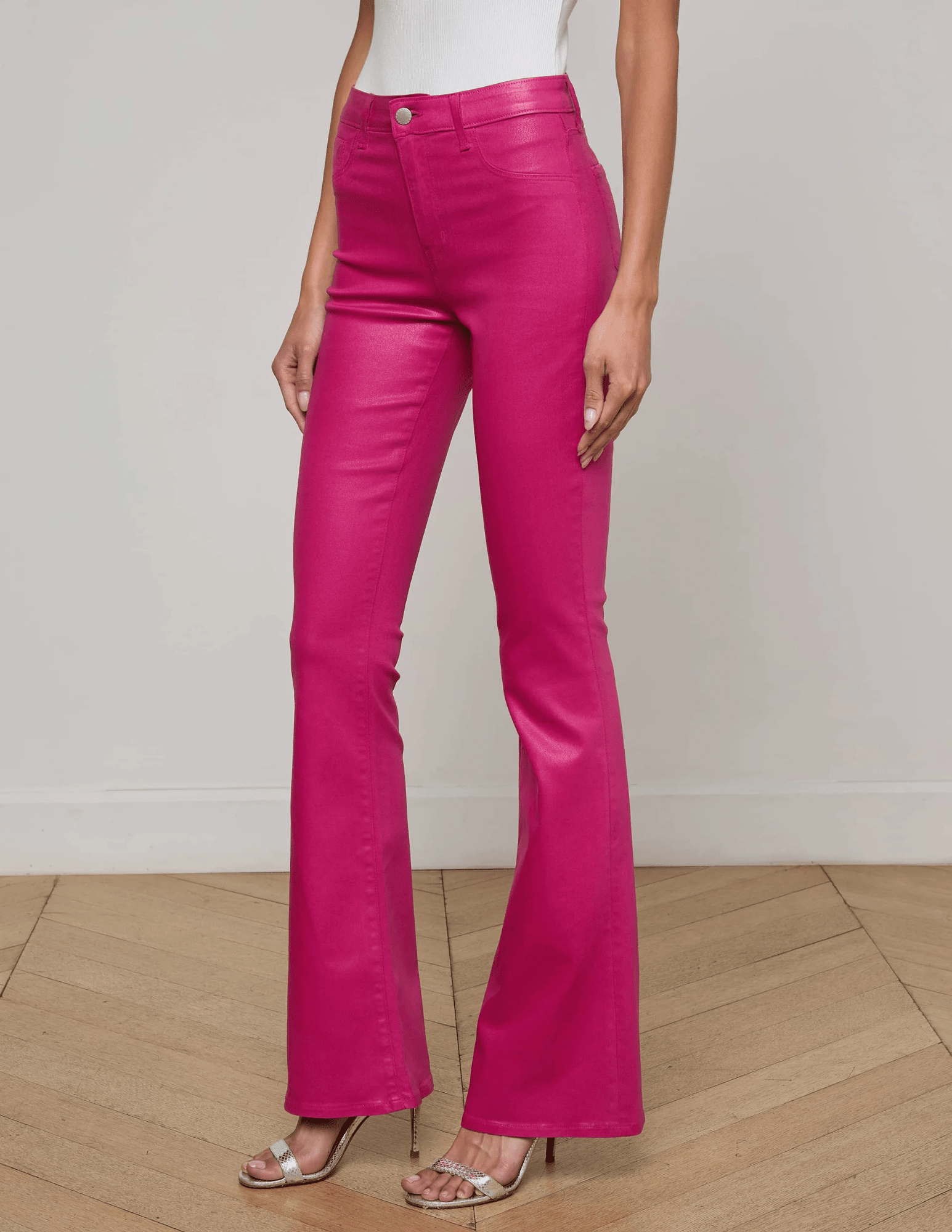 Side view of L’AGENCE Marty Pink Coated Denim Jean with flared leg