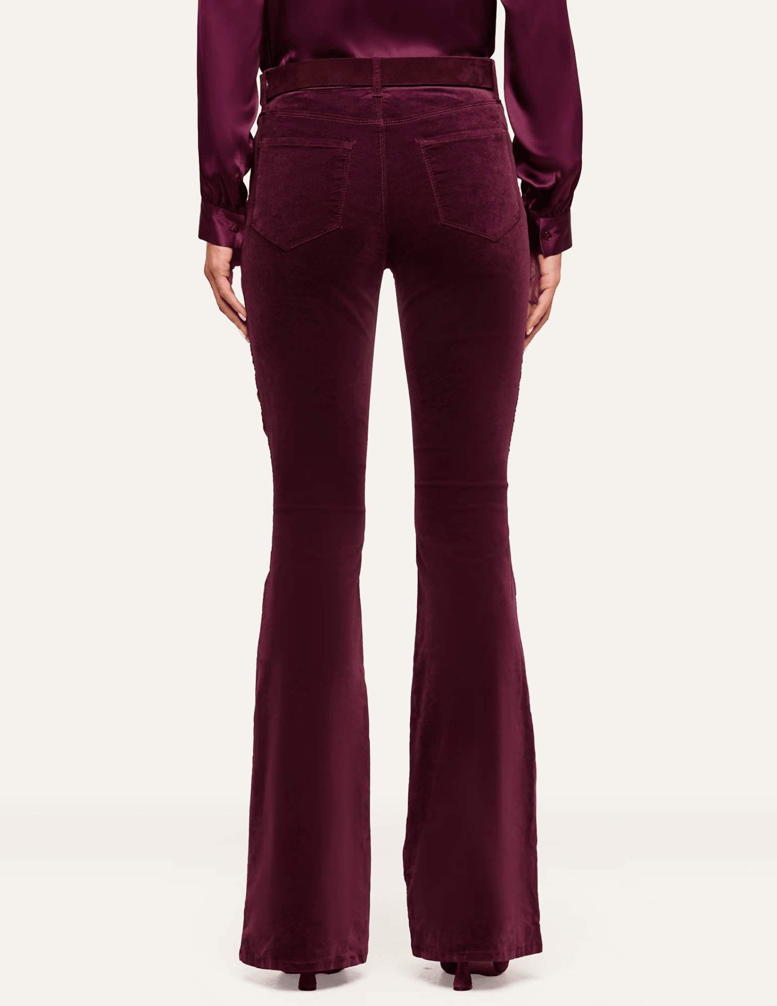 Back view of L'AGENCE Marty Velvet Ultra High Rise Jeans in Deep Sangria featuring classic back pockets and flared legs.