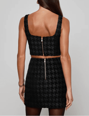 Back view of L’AGENCE Maylin Bralette Top featuring exposed zipper and cropped silhouette.