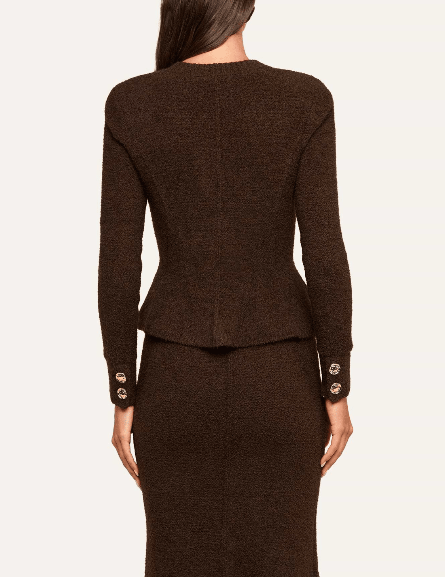 Back view of L'AGENCE Melissa Knit Flare Cardigan in Dark Brown showing its fitted silhouette and flared hem.