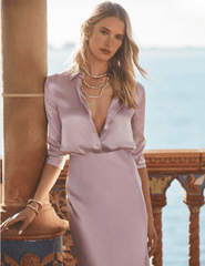 Model wearing L'AGENCE Perin icy lilac silk midi skirt