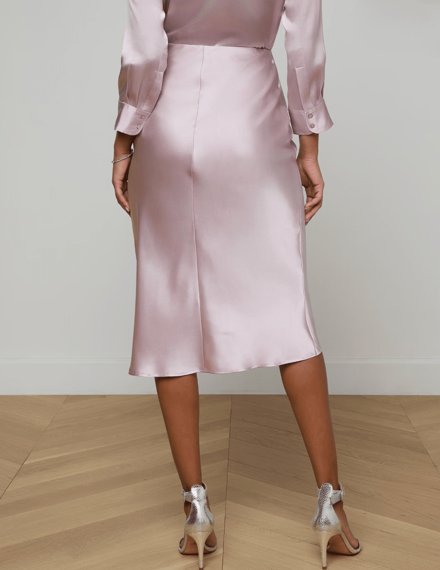 Back view of L'AGENCE Perin bias-cut silk midi skirt