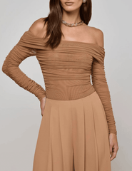 Front model view of Cinnamon Swirl off-shoulder long sleeve bodysuit by L’AGENCE