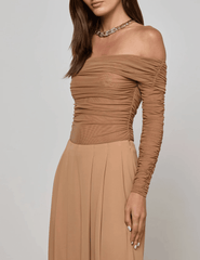 Side view of Cinnamon Swirl off-shoulder long sleeve bodysuit by L’AGENCE