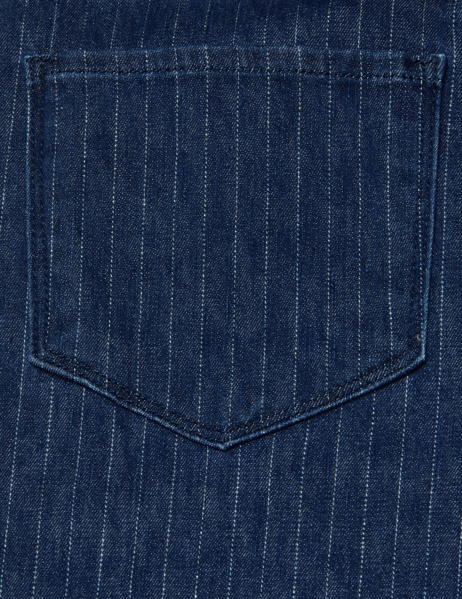 Close-up detail of the metallic pinstripe texture on denim