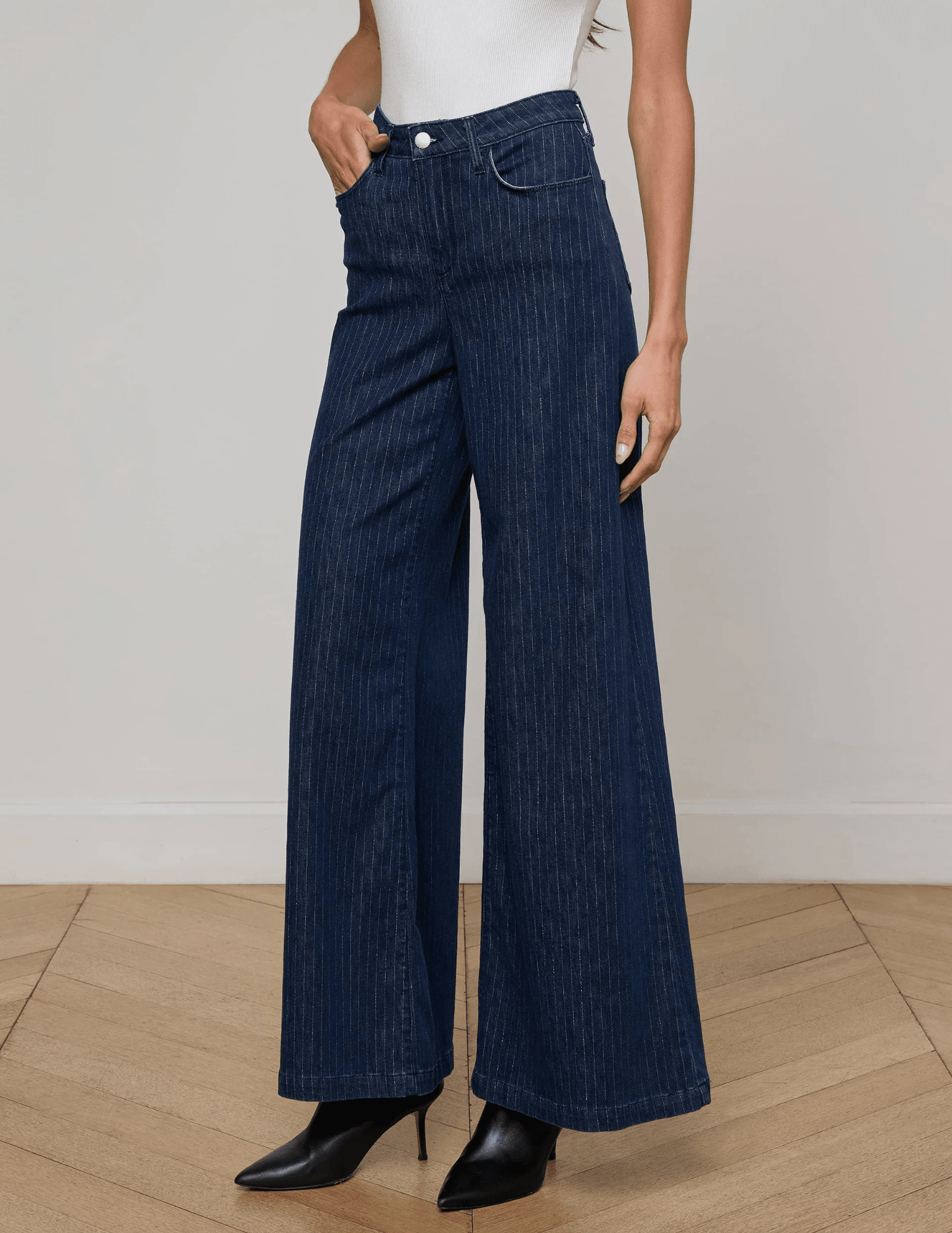 Side angle of wide-leg silhouette in L’AGENCE Quincy Jeans Ebony Stripe