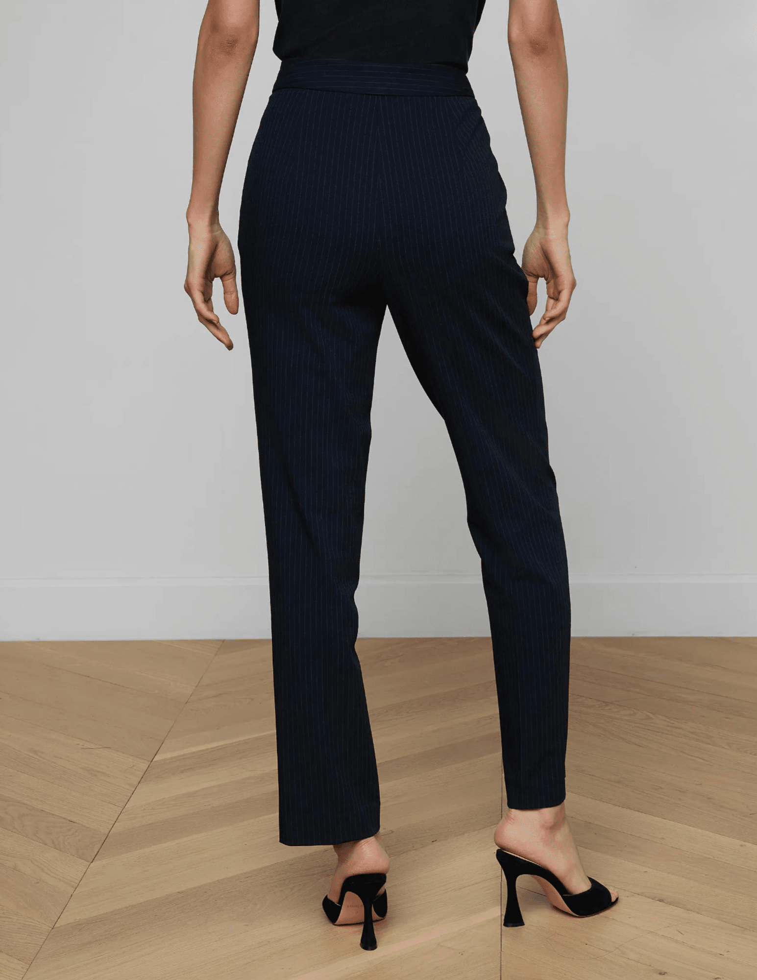 Back view of L’AGENCE Rebel trouser in midnight ivory pinstripe with high-waisted fit