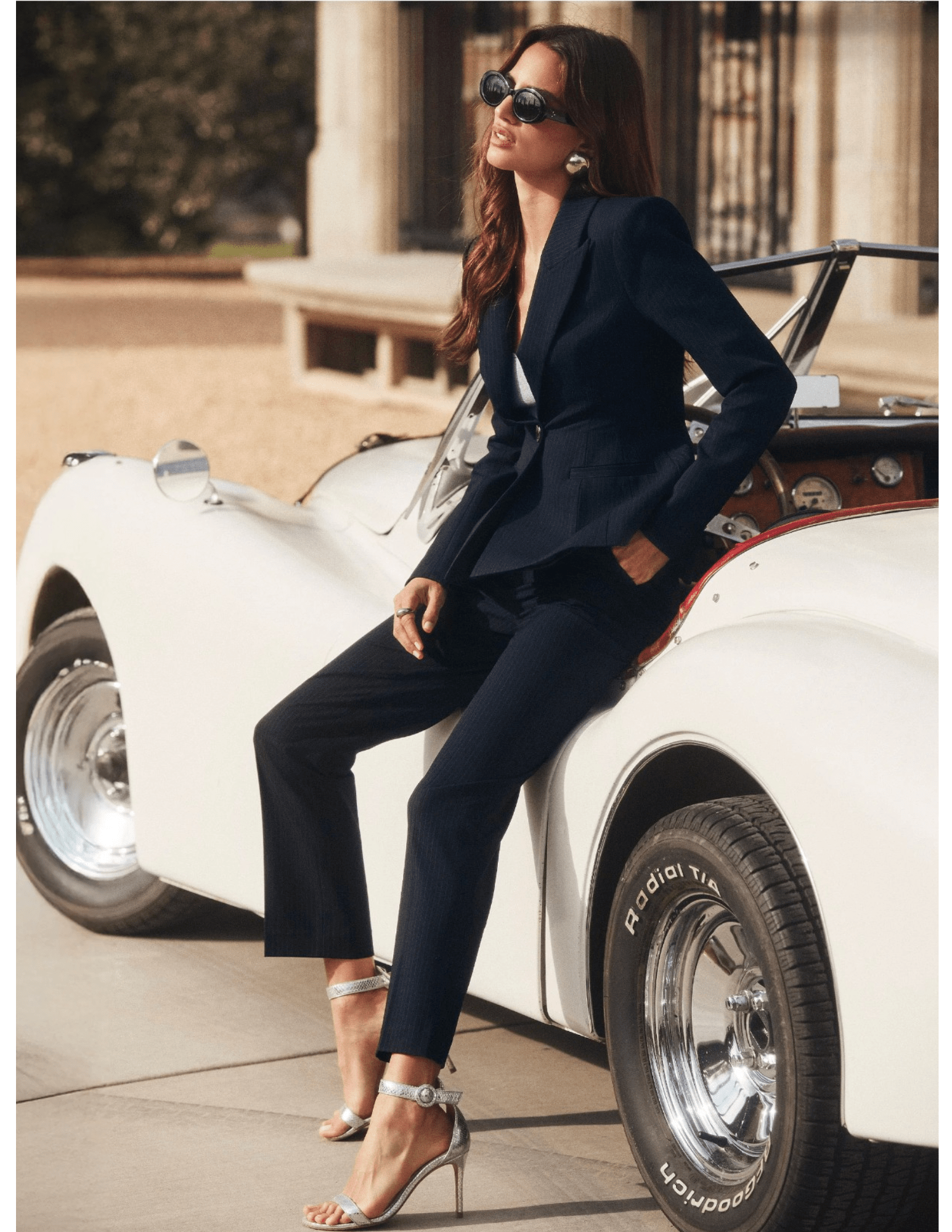 View of L’AGENCE Rebel trouser in midnight ivory pinstripe with high-waisted fit