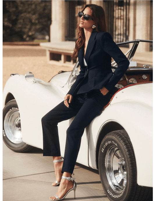 View of L’AGENCE Rebel trouser in midnight ivory pinstripe with high-waisted fit