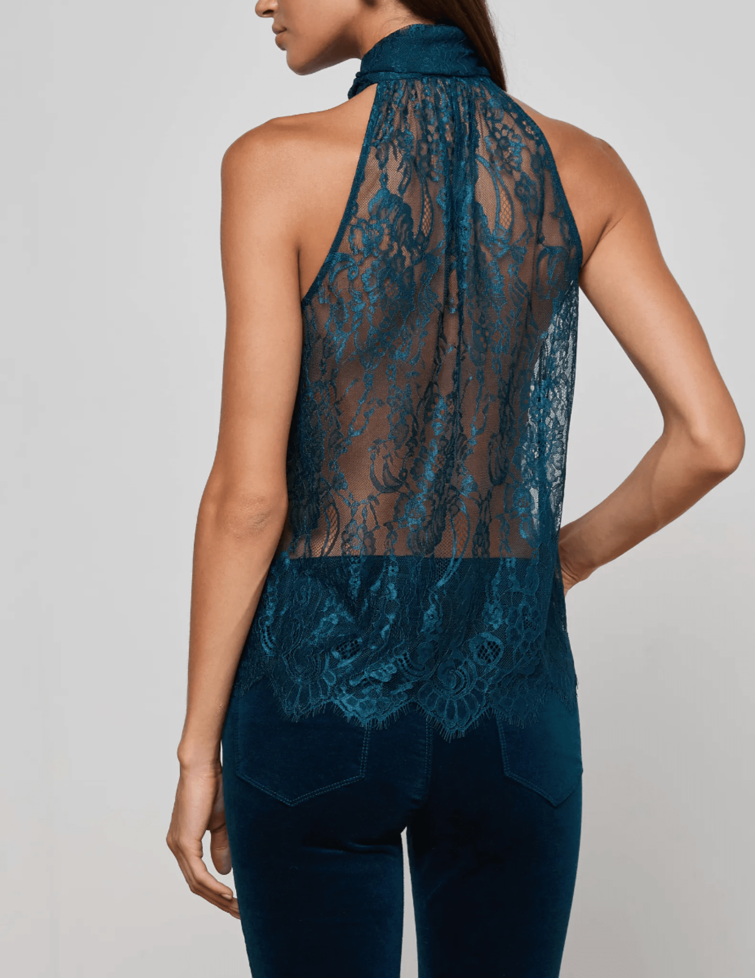 Back view of L’AGENCE Reece lace blouse in deep teal