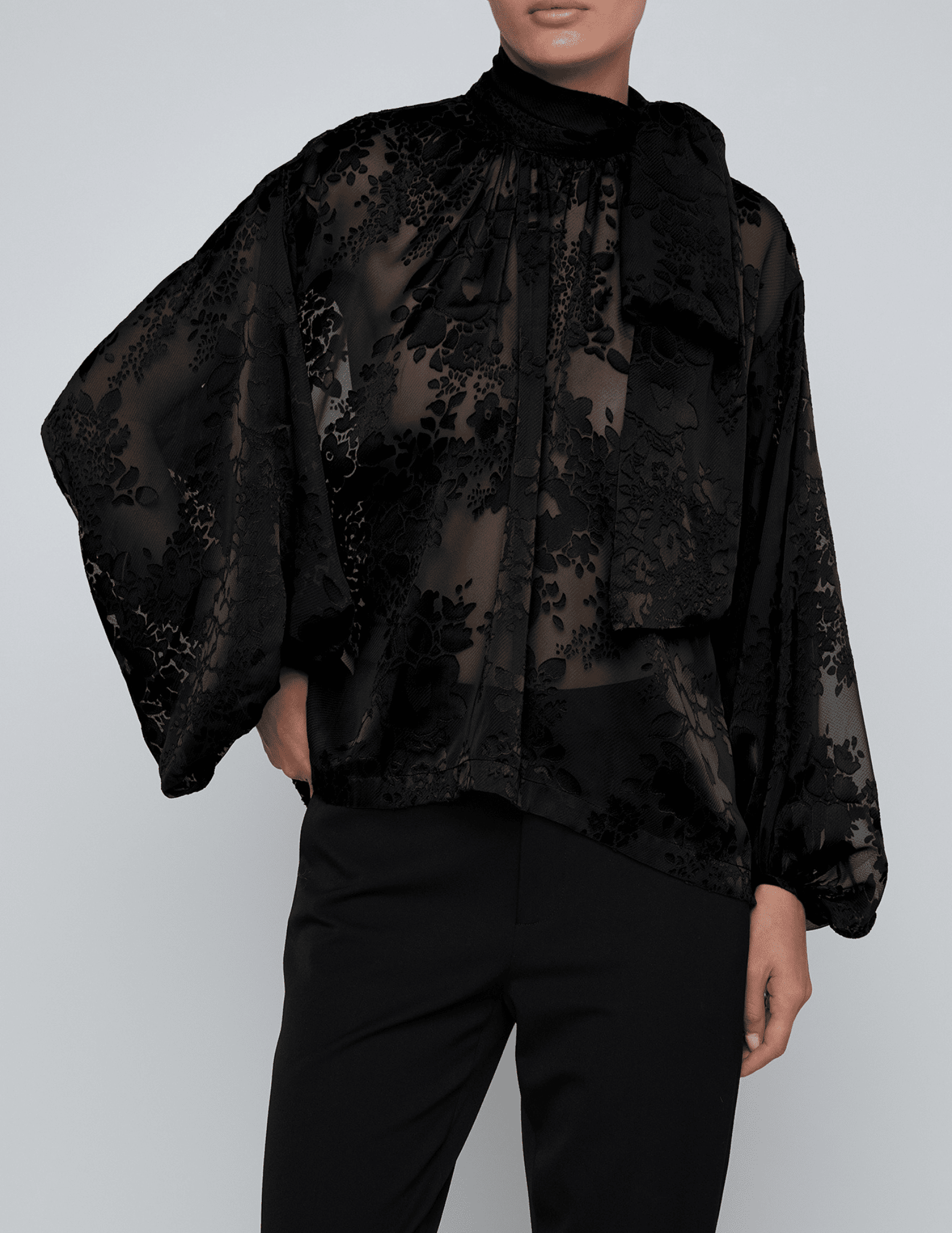 Front view of L’AGENCE Rhett Lace Oversized Blouse in black with mock neckline and blouson sleeves