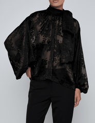 Front view of L’AGENCE Rhett Lace Oversized Blouse in black with mock neckline and blouson sleeves