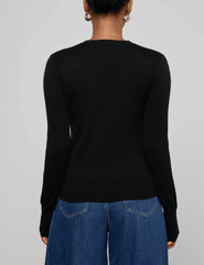 Back view of L’AGENCE Ronda long sleeve knit henley top in black