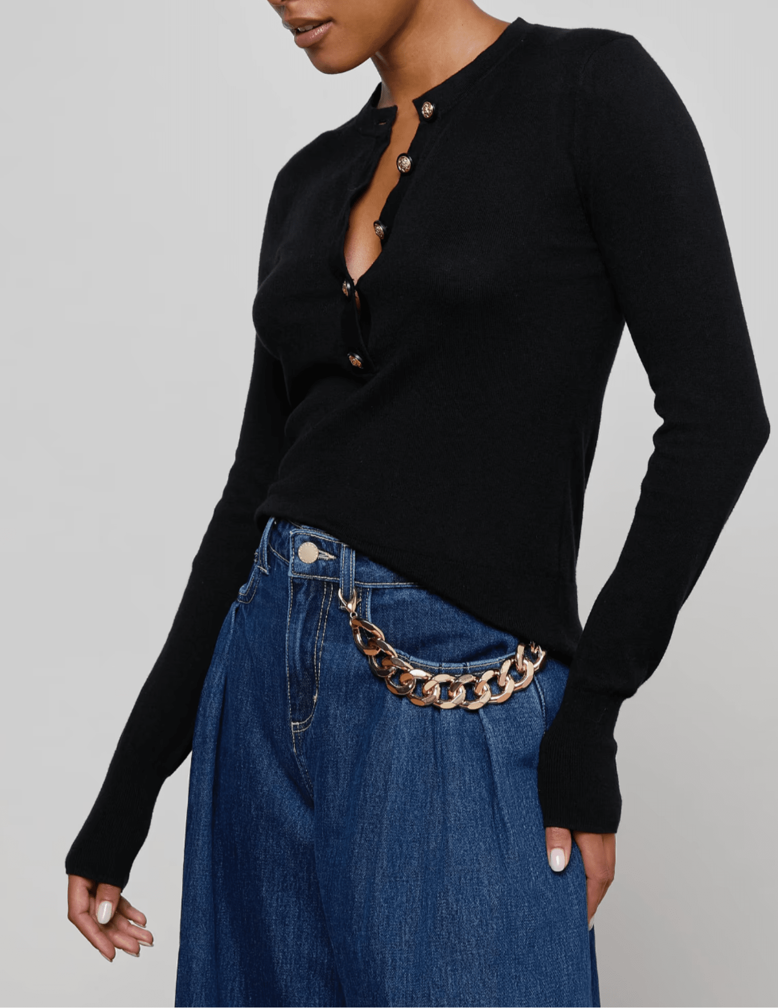 Side view of L’AGENCE Ronda long sleeve knit henley top in black