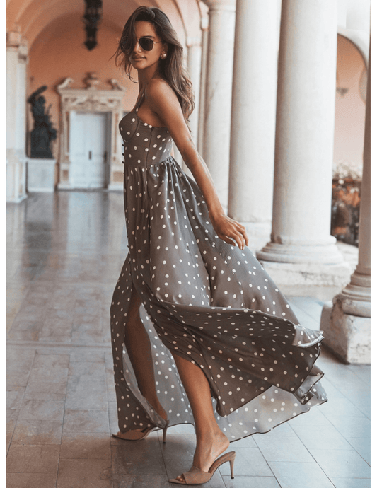 Model wearing L'AGENCE Rosette polka dot bustier maxi dress