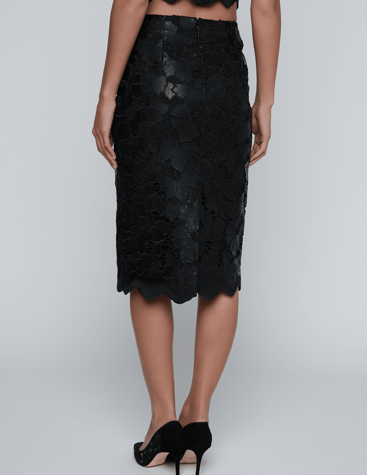 Back view of L’AGENCE black vegan leather pencil skirt