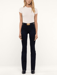 L'AGENCE Ruth High Rise Straight Jeans in Metro styled with a white fitted T-shirt, black belt, and ankle boots for a chic everyday look.