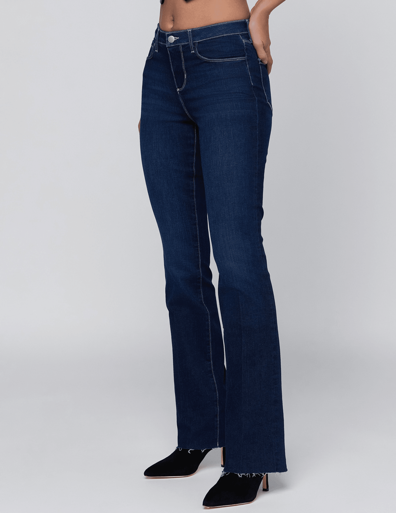 Side view of L'AGENCE Ruth Straight Leg Jeans in Robles showing the sleek silhouette and raw hem.