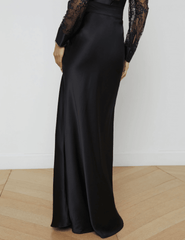 Back view of long black silk maxi skirt by L’AGENCE