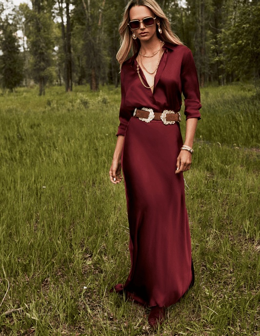 Lifestyle image of L'AGENCE Ryker Silk Maxi Skirt in Merlot Red