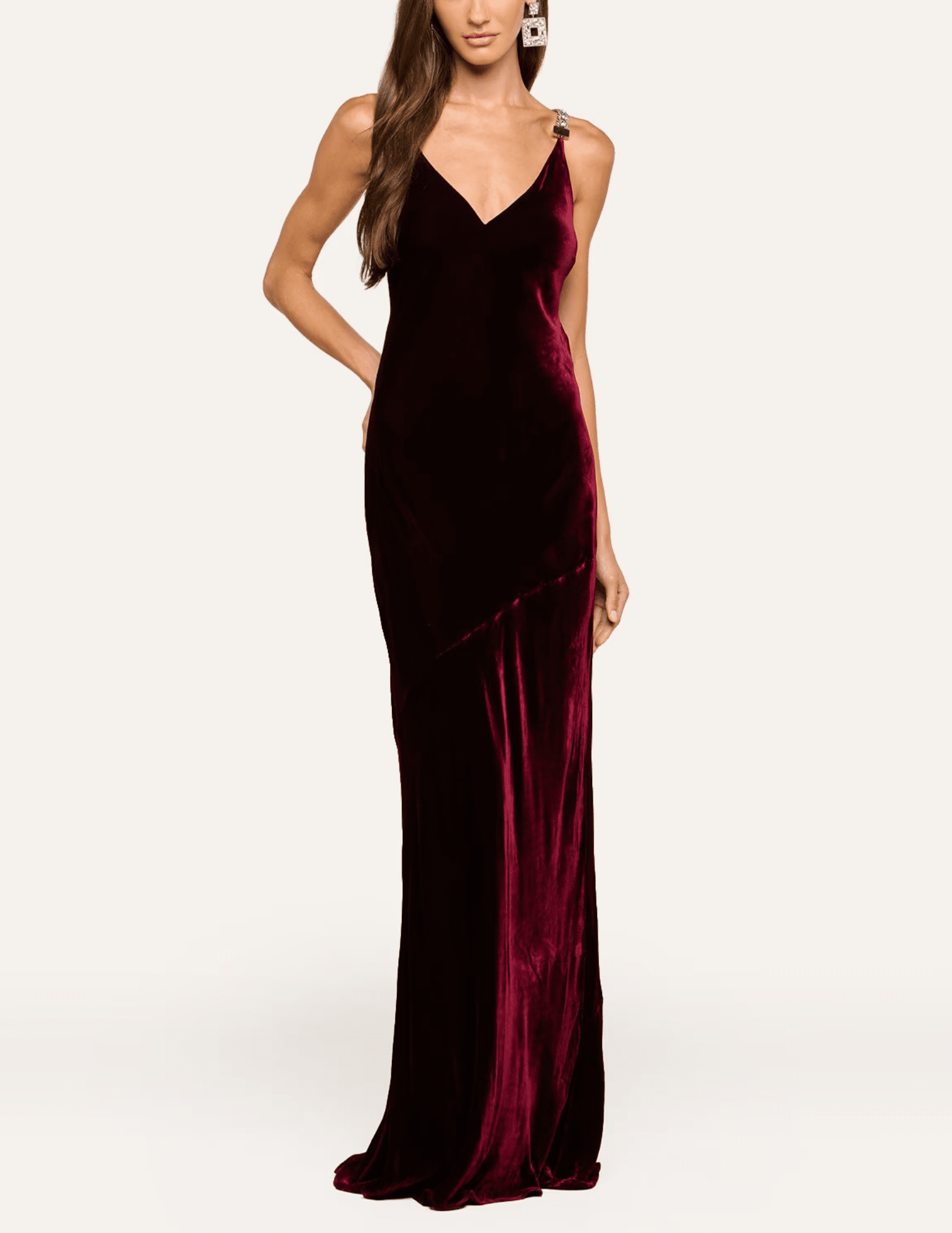 Model wearing L'AGENCE Saint burgundy velvet evening gown with a flattering body-skimming silhouette