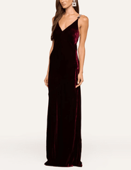 Side view of L'AGENCE Saint deep port velvet maxi gown with softly flared hem