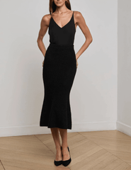 L’Agence Salem Knit Flare Midi Skirt in black with high-rise fit and flared hem model view