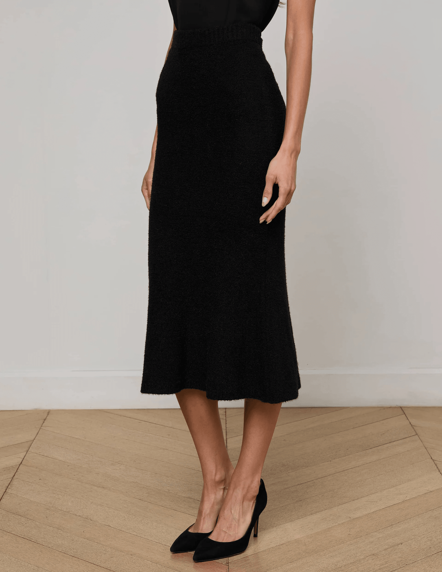L’Agence Salem Knit Flare Midi Skirt in black with high-rise fit and flared hem-side