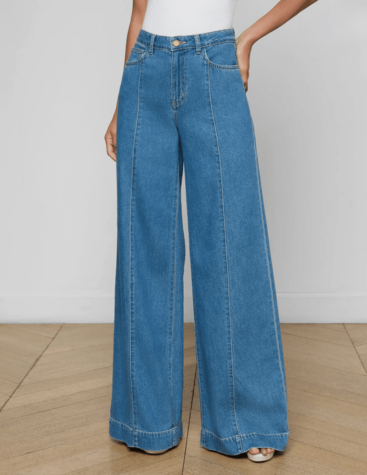 Model wearing L’AGENCE Sandy high rise wide leg jeans in Wilton wash