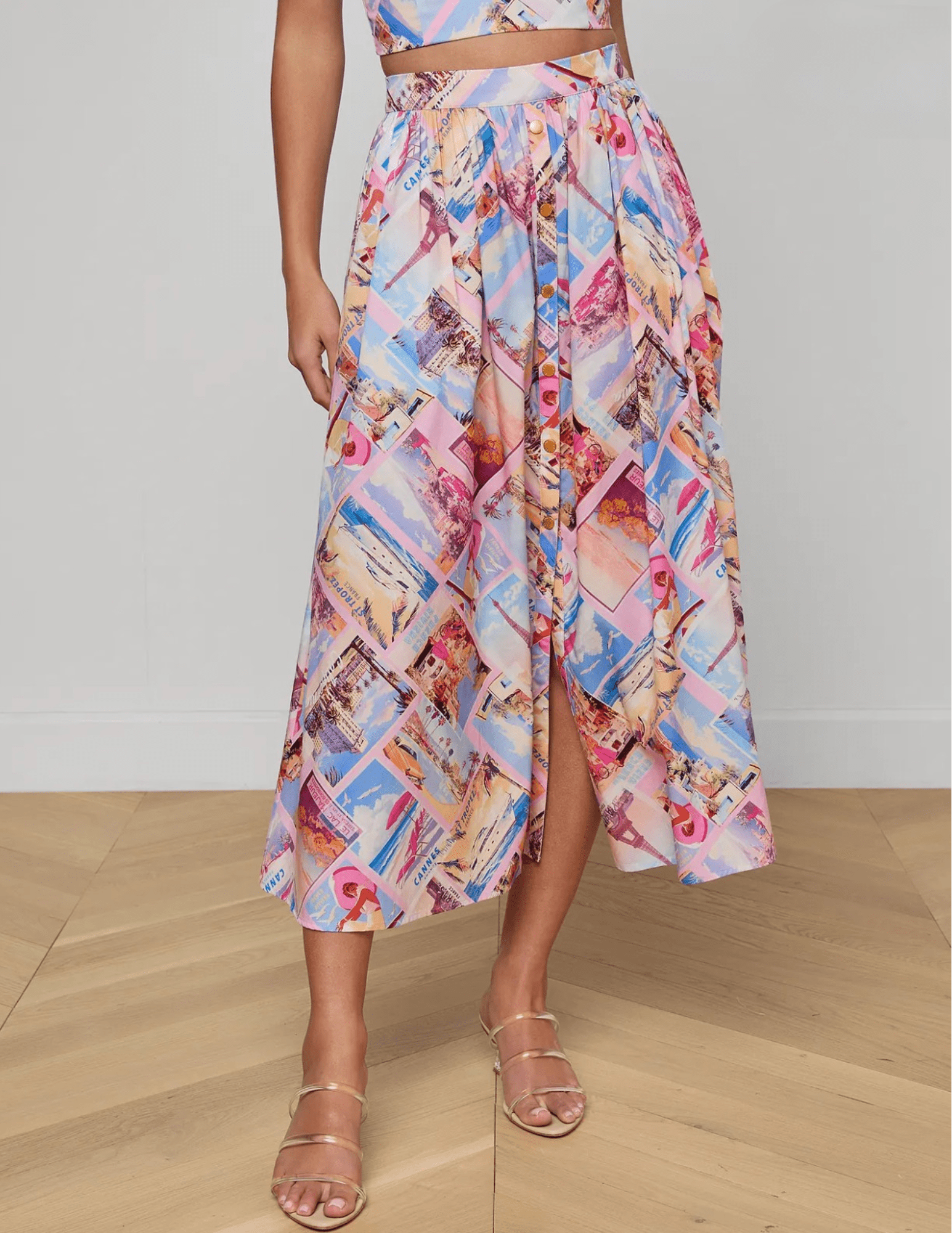 Front view of L'Agence Seina midi skirt in pink postcard print