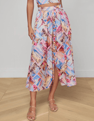 Front view of L'Agence Seina midi skirt in pink postcard print