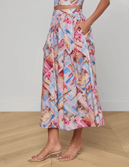 Side view of L'Agence Seina midi skirt in pink postcard print