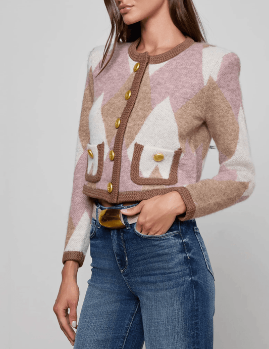Side view of L’AGENCE Siobhan fuzzy cardigan in natural and mauve argyle with gold dome buttons