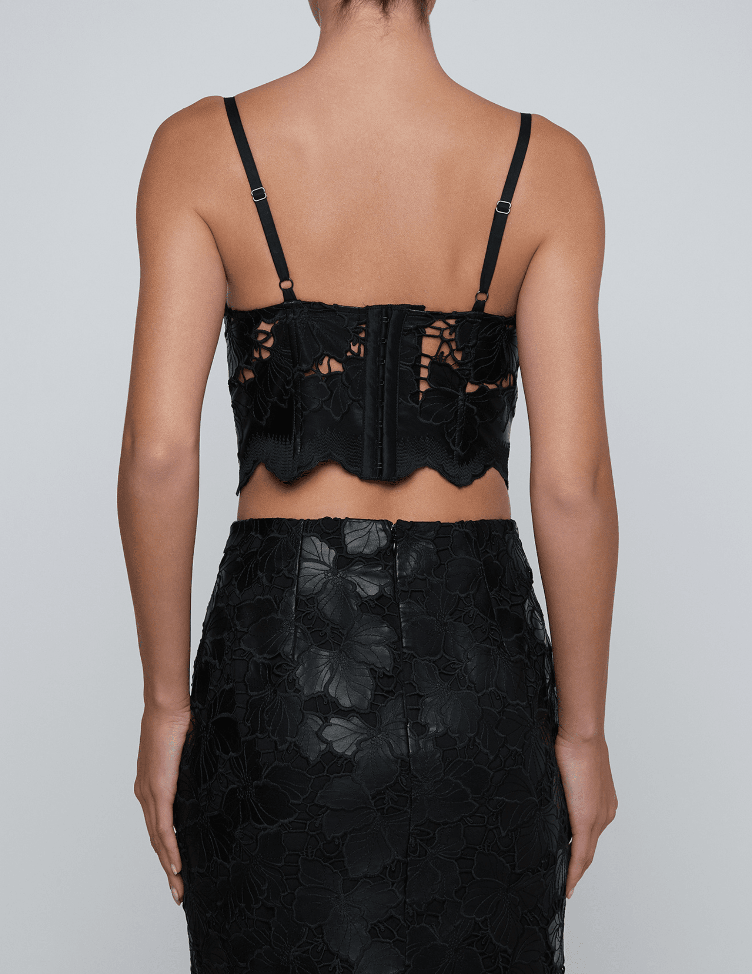 Back view of L’AGENCE Sonya black vegan leather lace bustier