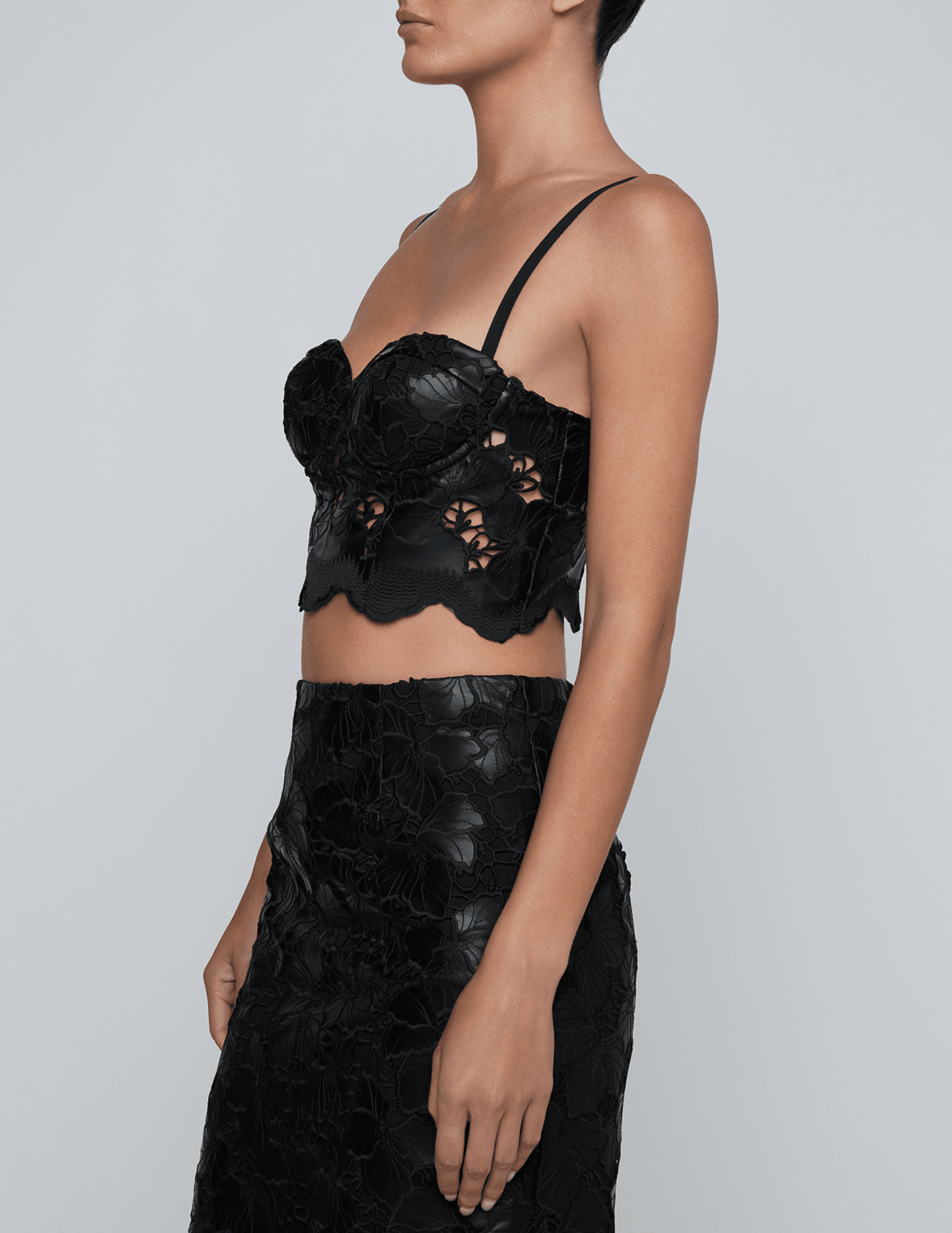 Side view of L’AGENCE Sonya black vegan leather lace bustier