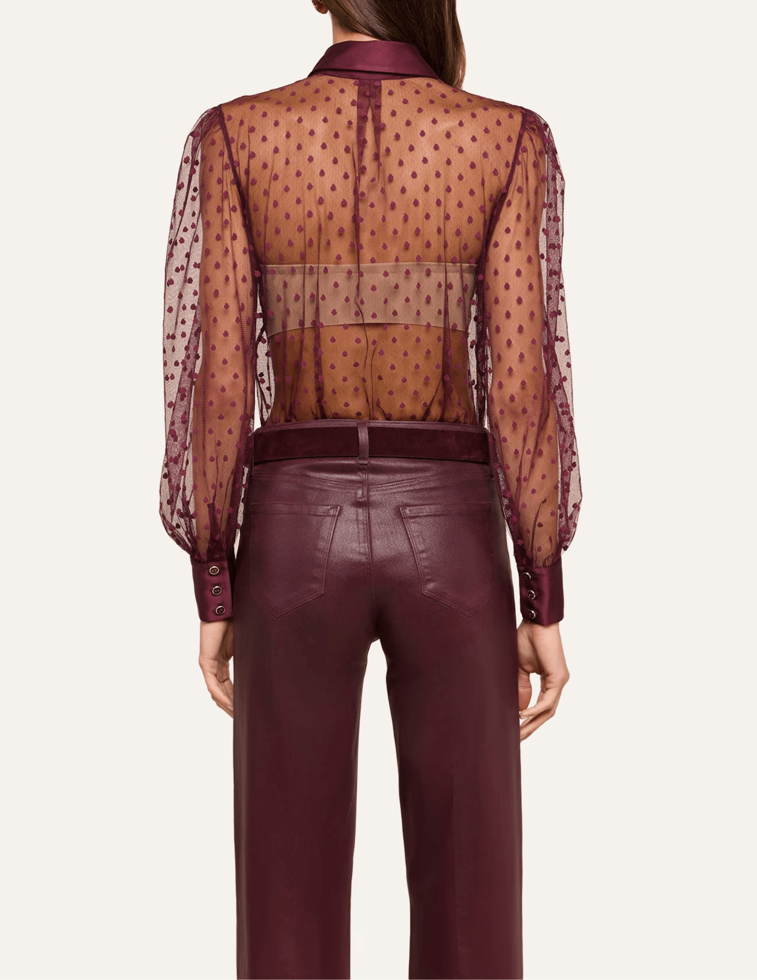Back view of L'AGENCE Sophie Swiss Dot Blouse in Deep Port showcasing its sheer fabric and elegant silhouette.