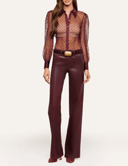 L'AGENCE Sophie Swiss Dot Blouse styled with burgundy leather trousers for a sophisticated evening outfit.