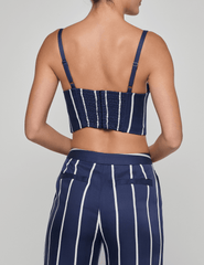 Back view of L’AGENCE bustier with smocked panel