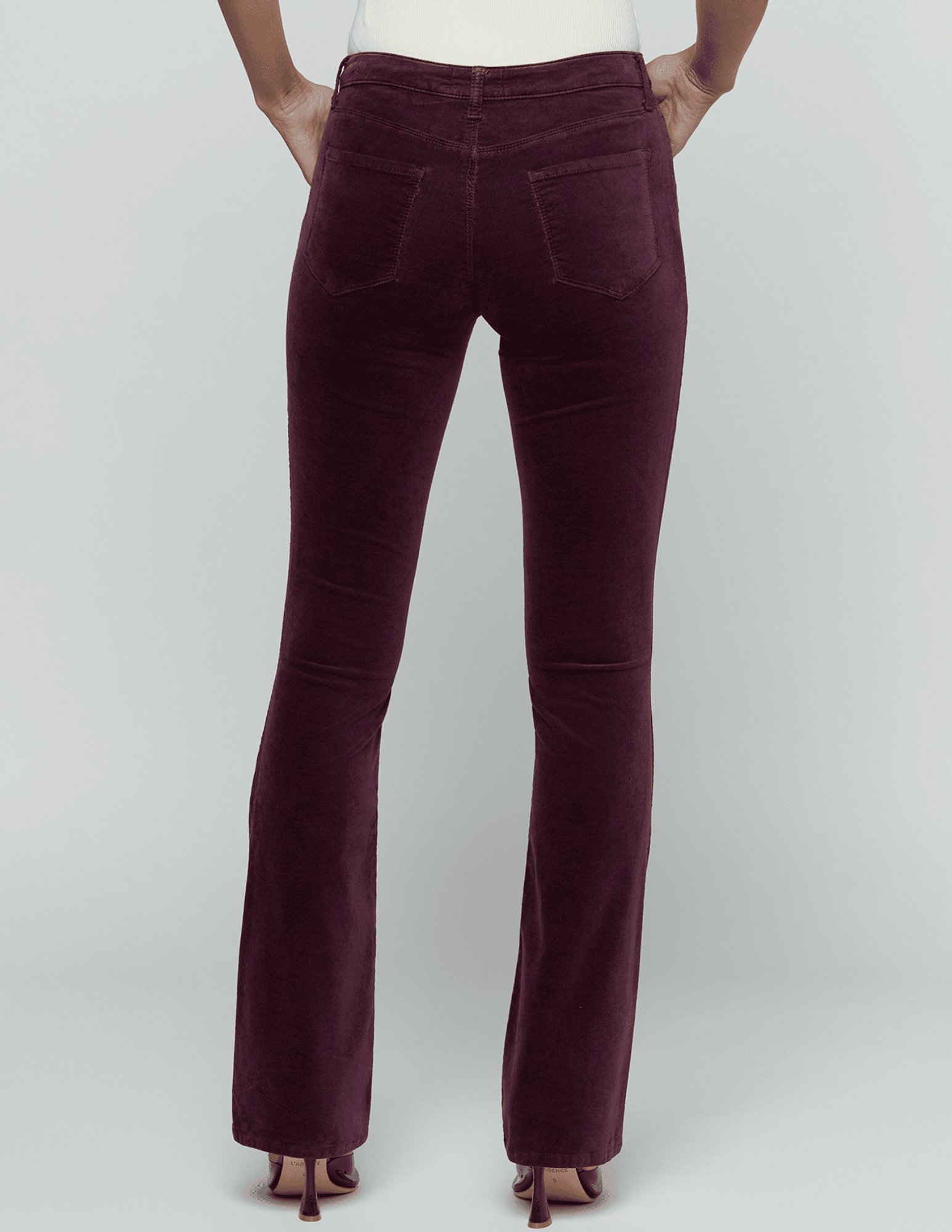 Back view of L'AGENCE Stevie Velvet Jean in Deep Sangria on model.