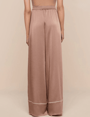 Back view of L’Agence satin trousers with relaxed fit