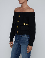 Side view of L’AGENCE Teri Off-Shoulder Cargo Sweater in black knit with cargo details.