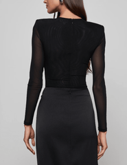 Back view of L’AGENCE Trista Mesh Bodysuit showing semi-sheer mesh and shoulder pads.