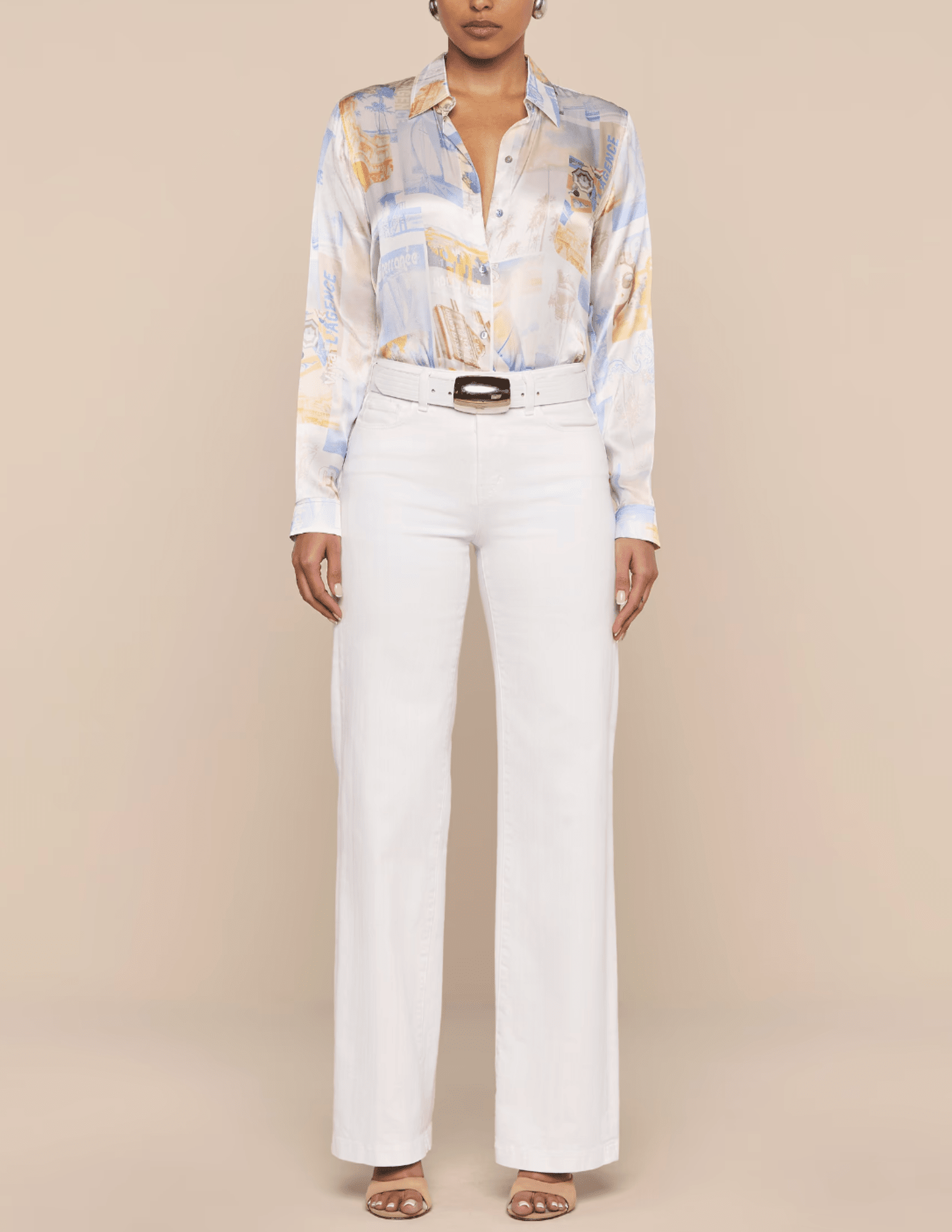 Model wearing L'AGENCE Tyler blouse styled with white pants