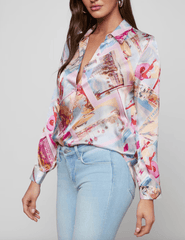 Side view of LAgence Tyler silk blouse in pink postcard print