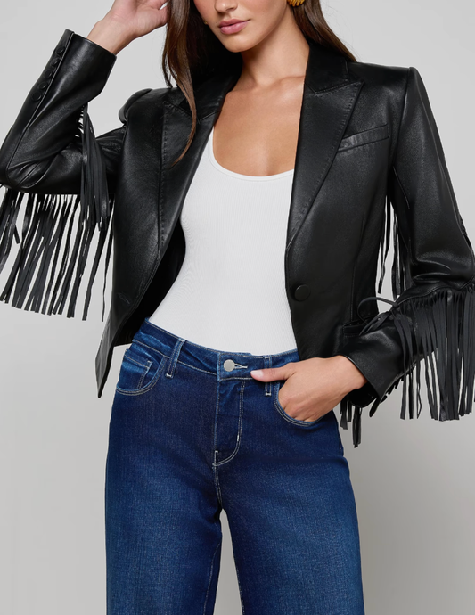 Model wearing L’AGENCE Vashti Black Fringe Leather Blazer with denim