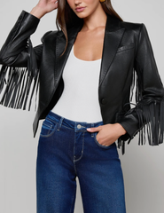 Model wearing L’AGENCE Vashti Black Fringe Leather Blazer with denim