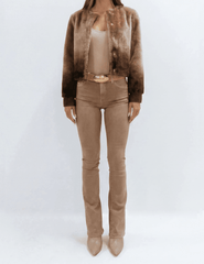 Model wearing the L'AGENCE Voltaire brown ombre shearling jacket with tonal brown pants.