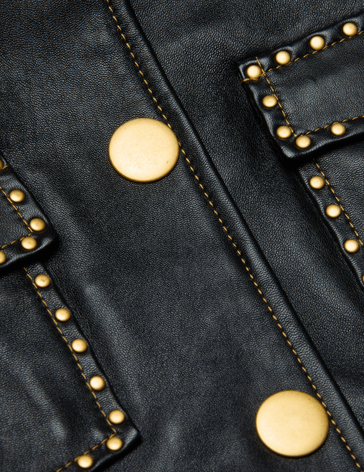 Close-up of gold stud detailing on L’AGENCE Winsome cropped leather jacket